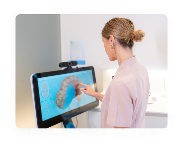 Dentist reviewing a 3D digital treatment plan on screen