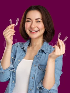 Hania Amir posing with a pair of invisible braces by ClearPath Ortho-Pakistan!